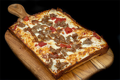 Detroit Style Pizza with pepperoni and sausage prepared for the best pizza takeout near Ashland, Cherry Hill, New Jersey.