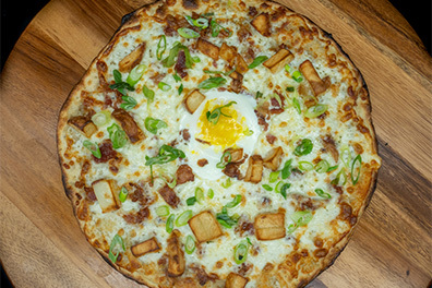 Round 12 inch Artisanal Pizza prepared at our Pizzeria near Collingswood.